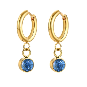 Detail of gold-plated stainless steel hoop earrings with a faceted blue zircon pendant