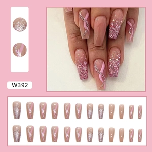 Detail of pink gradient ballet coffin press-on nails with glitter and ribbon design