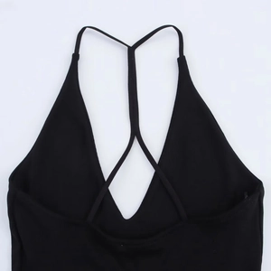 Detail shot of black ribbed knit halter neck dress showing strap stitching and texture