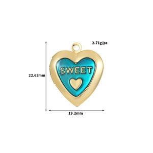 Macro detail of golden heart locket with blue Sweet engraving and precise dimensions