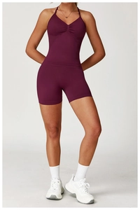 Close-up of seamless high-waist burgundy yoga shorts with textured matte finish and ruching