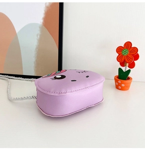 Close-up of a purple cartoon unicorn crossbody bag with durable PU leather and silver strap