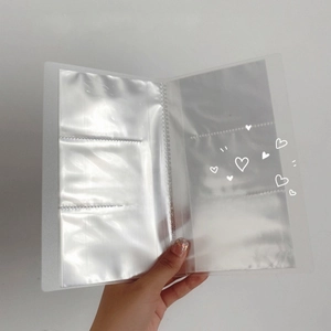 Portable 84-slot clear jewelry storage book with 3-grid pages for earrings and necklaces