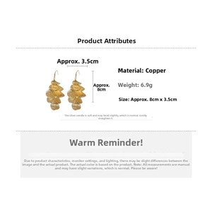 Detailed view of gold hollow petal tassel earrings with copper material and silver needle