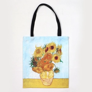 Canvas tote bag with Van Gogh Sunflowers painting and black handles on white background