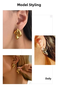 Detailed view of large gold and silver polished waterdrop earrings on model's ear