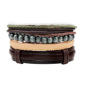Handmade multilayer leather bracelet set with woven ropes and beads on white background