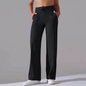 Close-up of black high-waisted wide-leg yoga pants with drawstring and side pockets