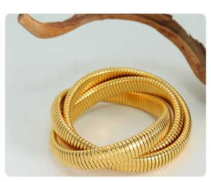 Close-up of triple-layered gold-plated snake bone textured stretch bracelet for women