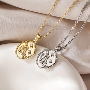 Minimalist butterfly relief pendant necklaces in gold and silver finish on silk