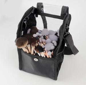 Detail of professional black makeup brush bag with clear PVC cover and adjustable strap