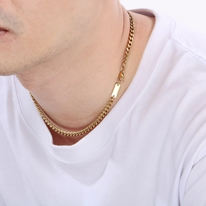 Polished gold Cuban link necklace for men with minimalist rectangular pendant on white t-shirt