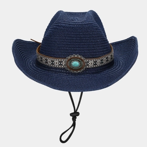 Detail of navy straw cowboy hat with ethnic patterned band and turquoise stone ornament