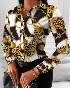 Close-up of women's V-neck long-sleeve blouse featuring chain and leopard print patterns