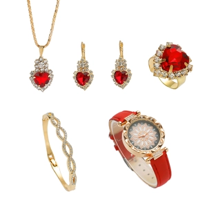 Elegant 5pcs gold jewelry set with red heart gems and a red quartz watch on white background