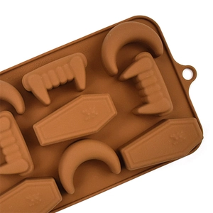 Detailed top view of brown silicone mold for Halloween vampire teeth and coffins