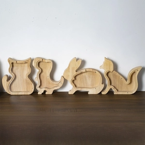 Variety of animal-shaped wooden piggy banks with transparent acrylic windows