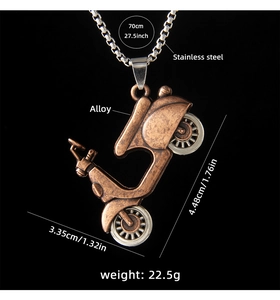 Detail of vintage bronze motor scooter pendant showing specific dimensions and metal weight