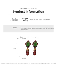 Detail view of vintage emerald green and ruby red rhinestone earrings with 6cm length