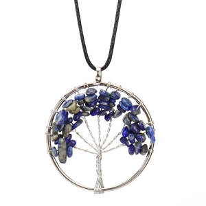 Detailed wire-wrapped Tree of Life pendant with lapis lazuli stones and silver wire