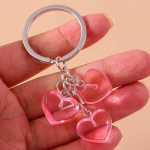 Detailed close-up of a pink jelly heart keychain with polished silver metal rings