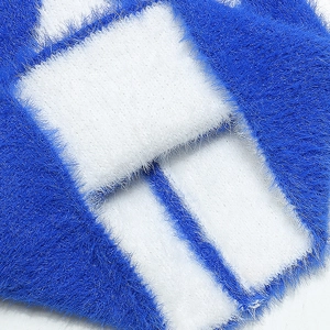 Macro shot of high-quality fluffy faux mink fur fabric in cobalt blue and white