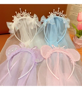 Detail view of princess crown headbands with sequins, bows and mesh veils in four colors