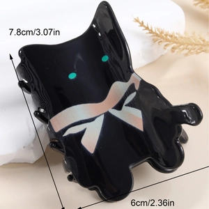 Abstract black acetate cat hair claw clip with holographic bow detail, 7.8cm size