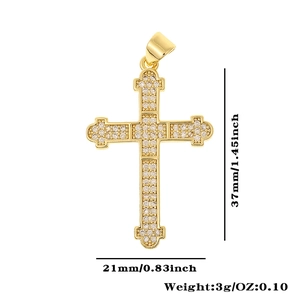 Detailed view of gold cross pendant with cubic zirconia inlay and precise dimensions