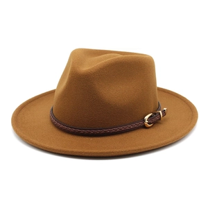 Detail of wool fedora with brown leather band and golden metallic horseshoe buckle