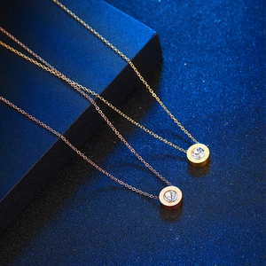 Titanium steel necklace with crystal pendant and Roman numerals in gold and rose gold