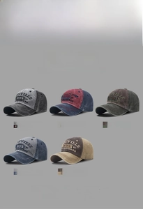 Detail of five colors of vintage washed cotton baseball caps with Osville NYS 84 embroidery