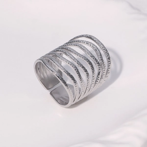 Silver multi-layer stackable stainless steel open ring with textured dot pattern
