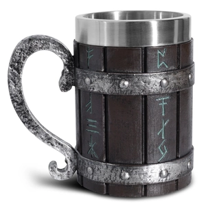Detailed macro view of Viking beer tankard with stainless steel liner and engraved runes
