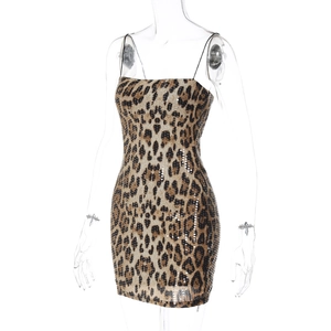 Detailed macro shot of shimmering sequins on a stylish leopard print bodycon mini dress