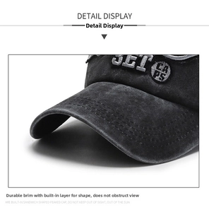 Detail of vintage washed black cotton baseball cap with high-quality JET CAPS embroidery