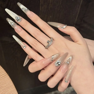 Sparkling cat-eye stiletto press-on nails with silver glitter, rhinestones and luxury chains