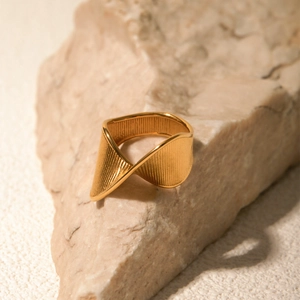 18k gold plated stainless steel twisted ring with textured wide band on stone