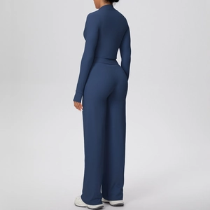 Detail view of navy blue fitness set showing back profile and premium knit texture