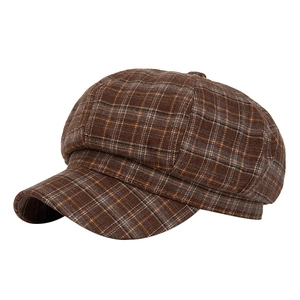 Classic brown plaid newsboy cap featuring a vintage aesthetic and premium wool texture