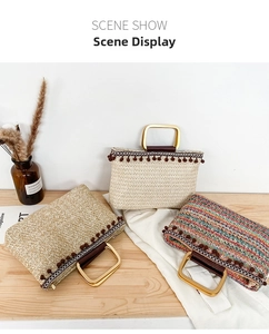 Straw tote bags with golden square handles and decorative pom-poms in a scene show