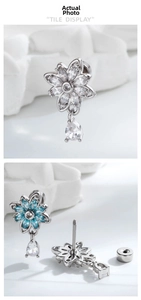 Detail of flower stud earring with blue water drop zircon and screw back closure