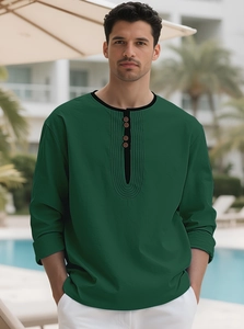 Detail of forest green Henley shirt with linen texture and wooden buttons