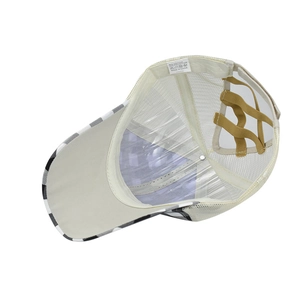 Detail view of plaid baseball cap with mesh back, criss-cross bands, and fabric care label