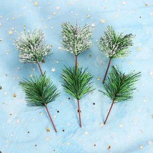 Set of six artificial pine branches with frosted snow effect on blue starry fabric