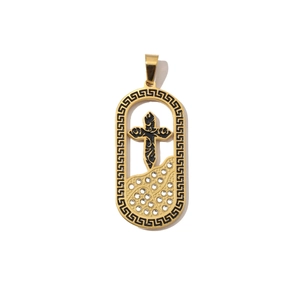 Macro detail of golden cross pendant with white rhinestones and black greek key patterns