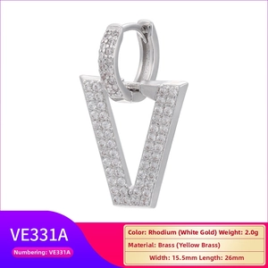 Detail view of V-shaped brass earrings with micro-pave white cubic zirconia stones