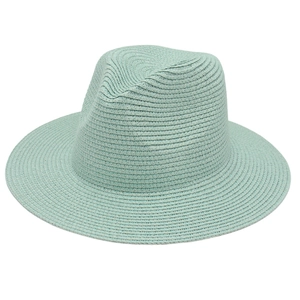 Detailed weave texture of mint green Panama straw hat with a wide flat brim and jazz crown
