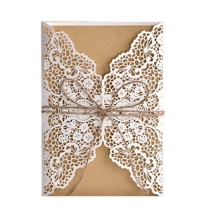 Laser cut white floral wedding invitation cover with kraft paper and hemp rope tie