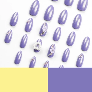 Purple glitter press-on nails with 3D floral accents, pearls and rhinestone heart designs